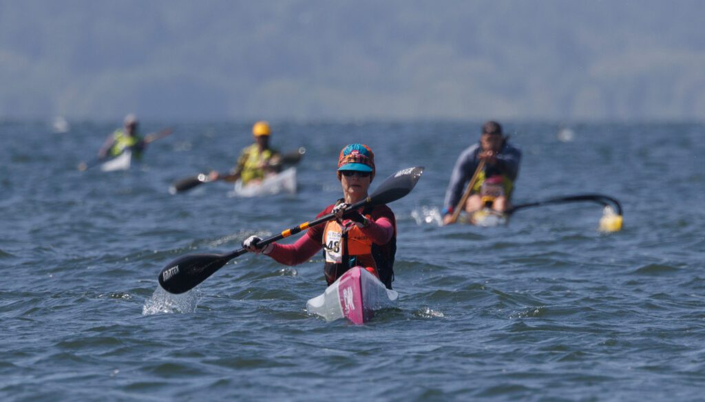 Denise Weeks leads kayakers to the finish line.