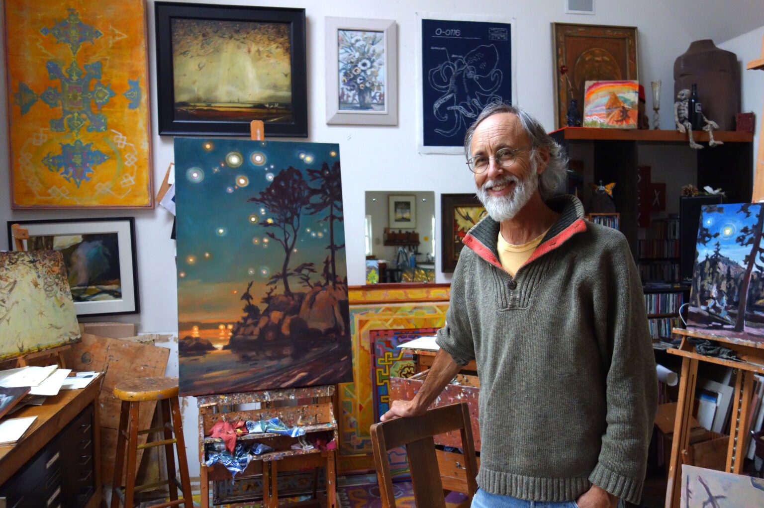 Bellingham artist Tom Wood during a tour at his Oyster Dome Studio in 2018. Most of the pictured artworks are by Wood
