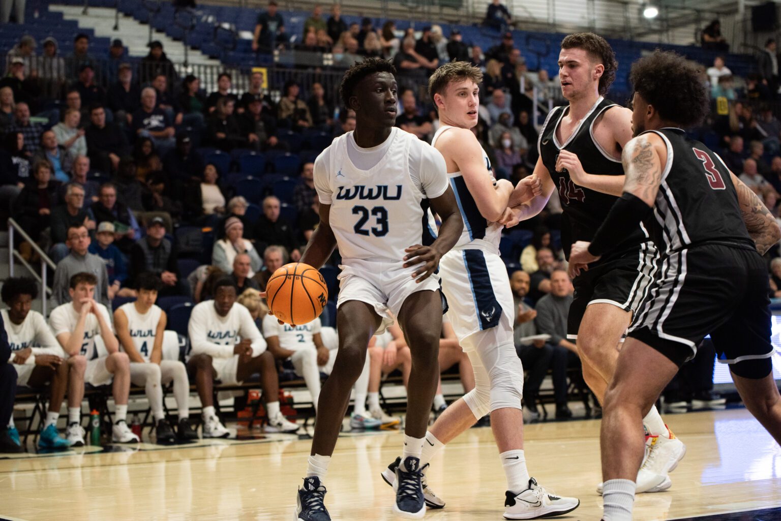 Western Washington University freshman forward BJ Kolly looks to pass the ball during a 90-73 loss Jan. 7 against Seattle Pacific University. Kolly was selected as the Great Northwest Athletic Conference Freshman of the Year