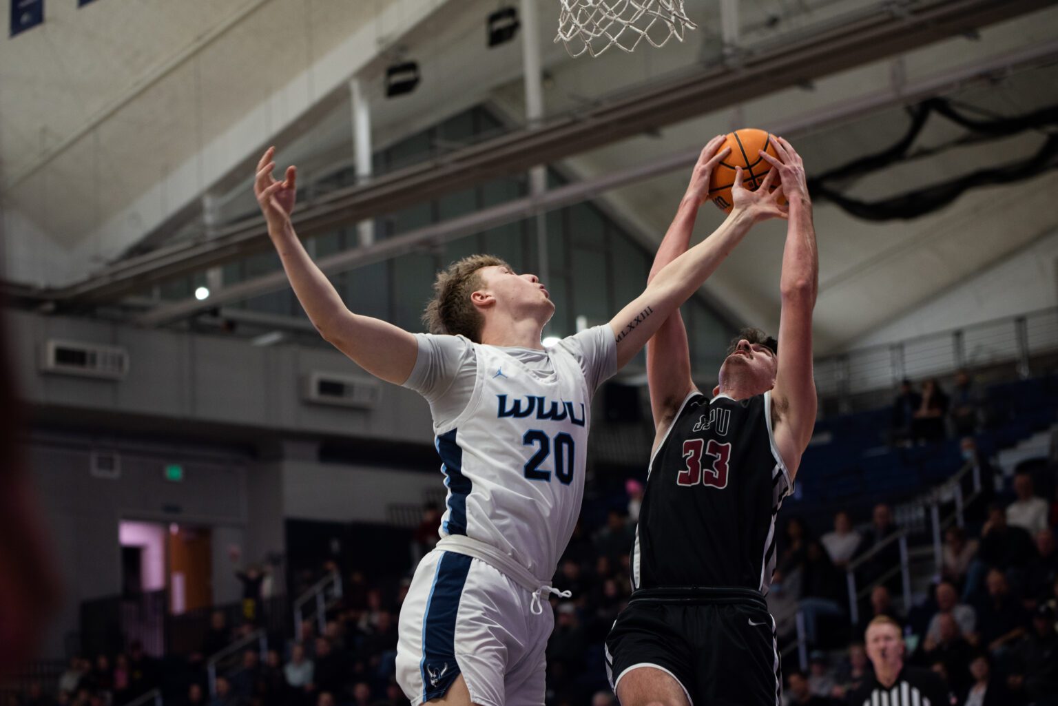 Western sophomore forward Nic Welp battles for a rebound during a 90-73 loss against Seattle Pacific University on Jan. 7.