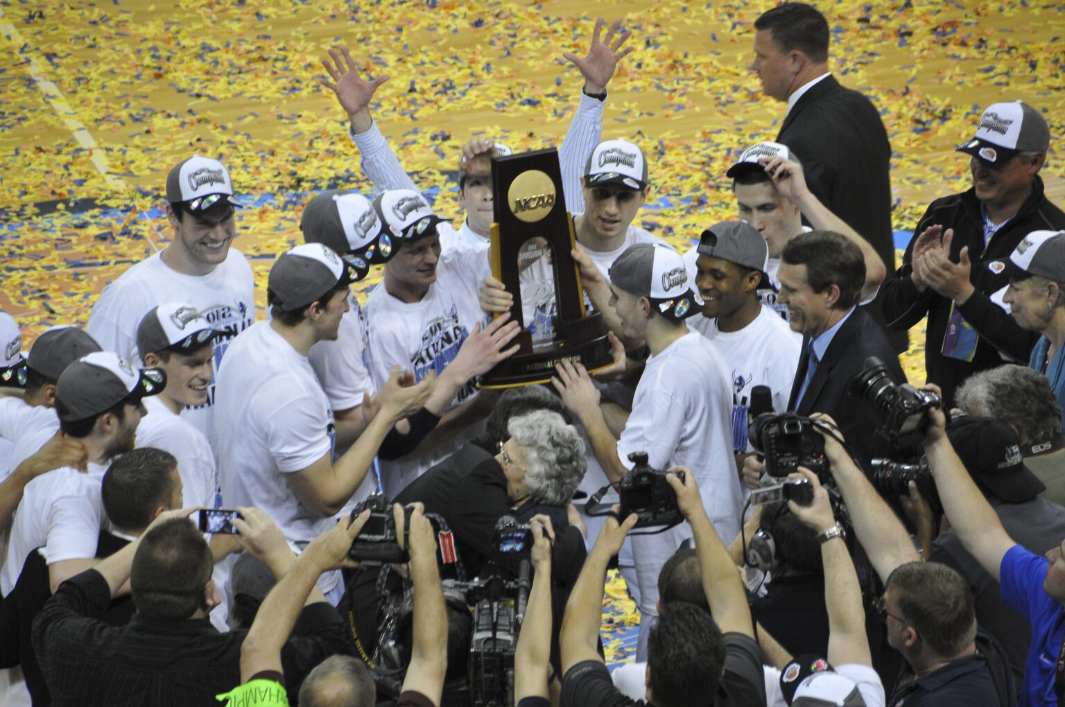 The Western men's basketball team celebrates on the court after winning the 2012 Division II national championship.