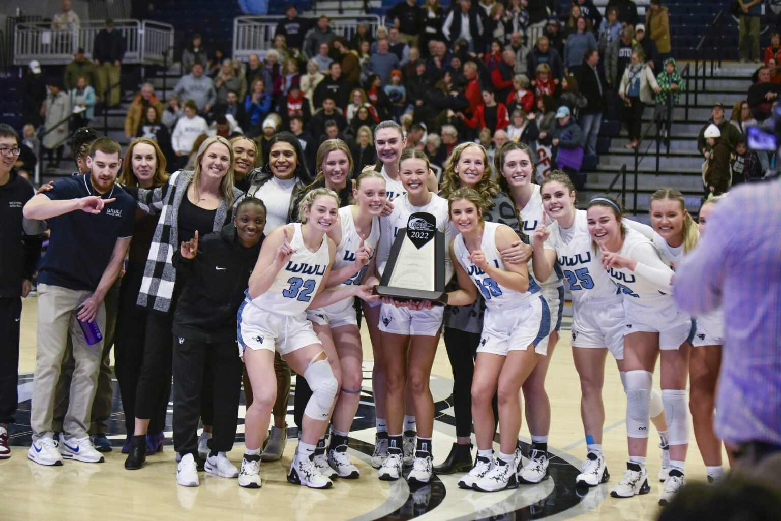 Western Washington University women's basketball team poses Feb. 23 with the Great Northwest Athletic Conference regular-season title trophy. The Vikings defeated Simon Fraser University 87-63 to cement their spot atop the conference.