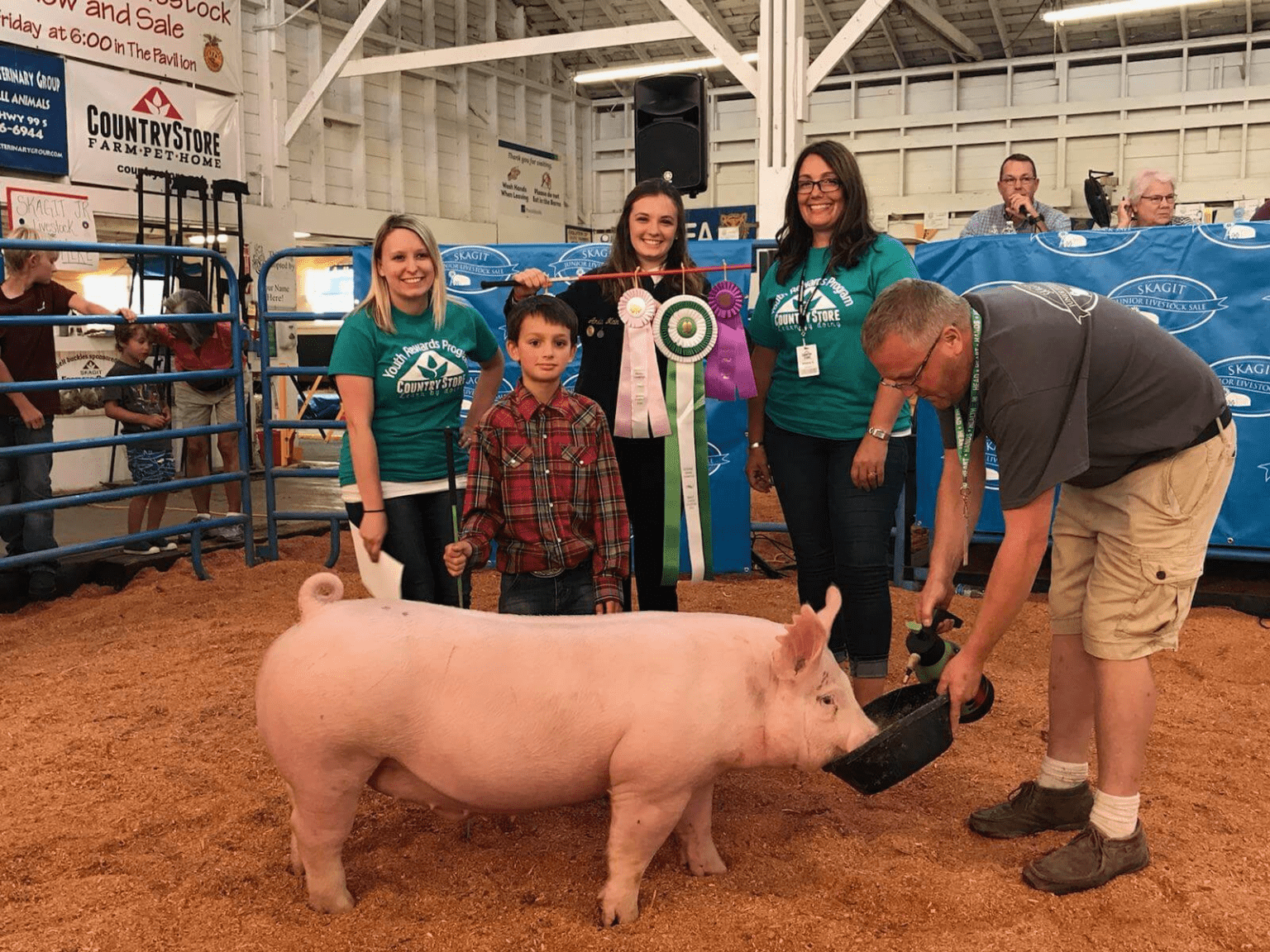 Skagit Farmers Supply's Country Store purchases a hog from the youth livestock show at the Skagit County Fair