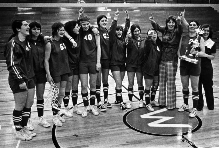 The 1972–73 Western Washington University women's basketball team celebrates its 48-46 regionals win over Washington State University