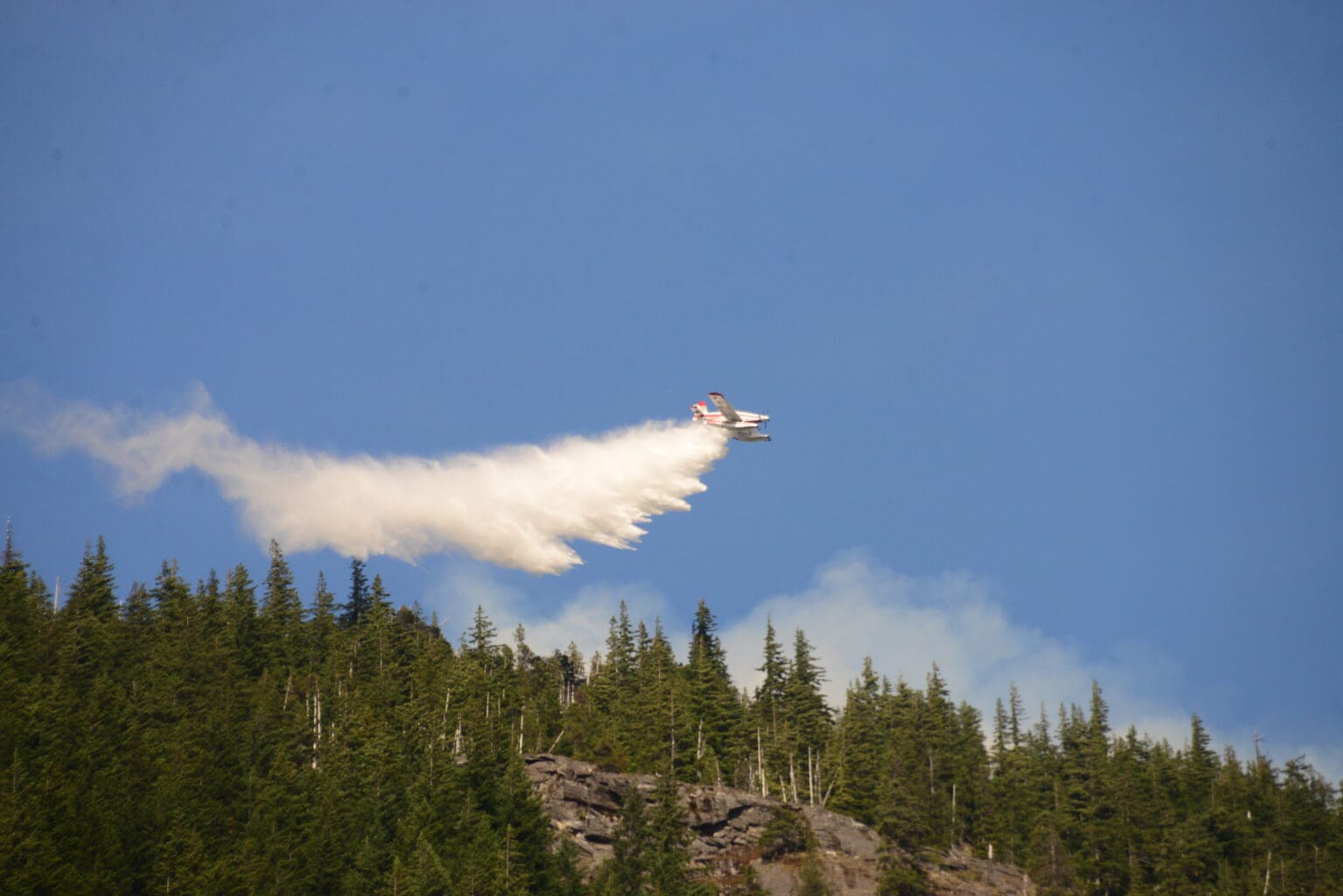 Several planes and helicopters were deployed to fight the Sourdough wildfire near Diablo Lake Saturday