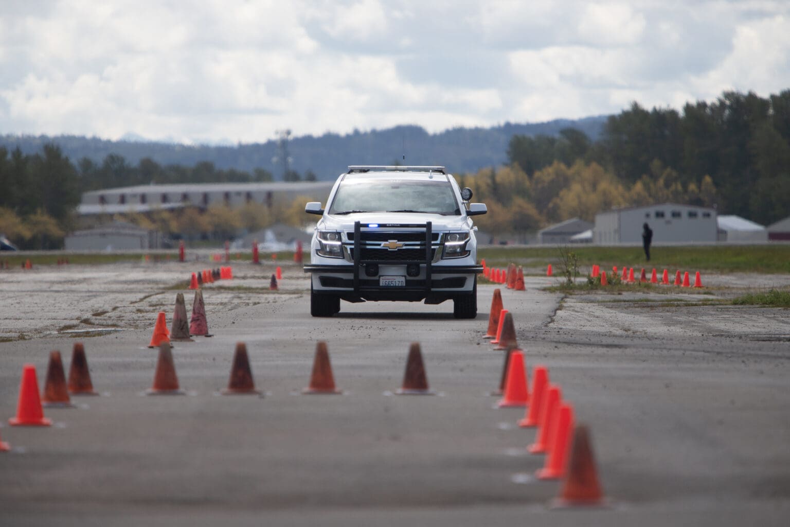 A Bellingham Police Department vehicle navigates a driving course in May 2022. Officers in training must prove themselves physically and psychologically before they join the force