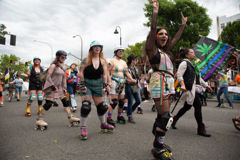 Participants skate through the Pride Parade on Railroad Avenue on July 17