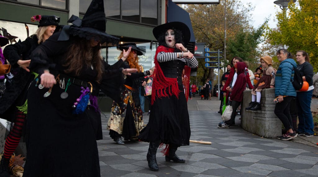 The Bellingham Witches — dances in front of an unsuspecting audience of parents and their children dressed for Halloween.