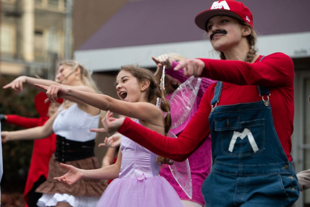Dancers from Evolution Dance Co. perform a routine to "the Witches Are Back" from Hocus Pocus 2 while dressed as different characters like Mario and a fairy.
