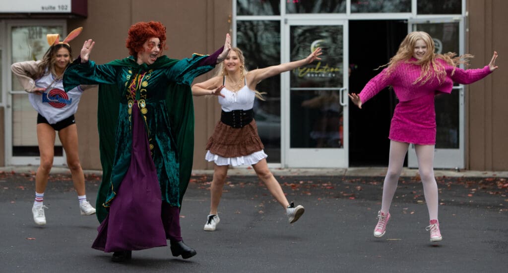 Evolution Dance Co. dancers, led by Winifred Sanderson of Hocus Pocus, perform dressed as different characters from different media.