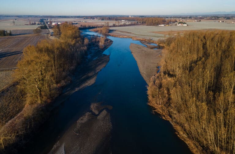 Whatcom County farmers called foul after water quality tests showed high levels of bacteria flowing into rivers and streams from north of the border.
