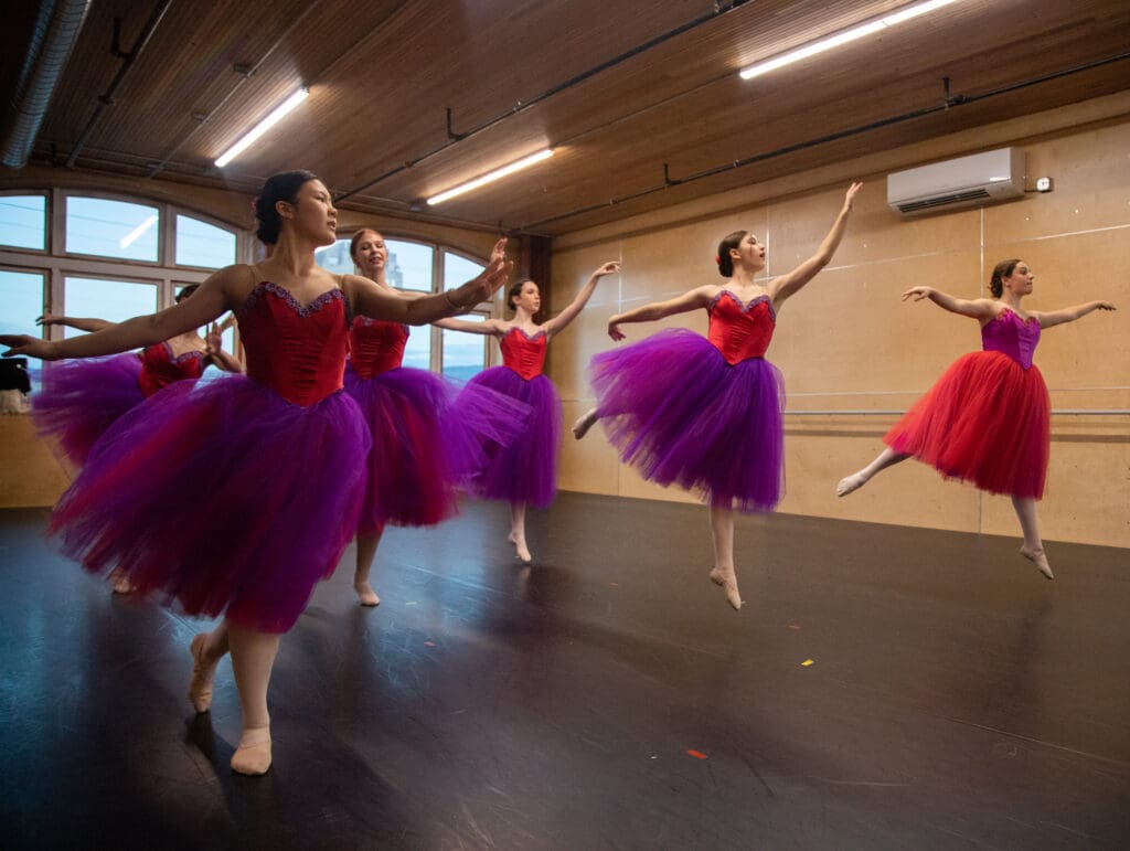 Dancers perform "Waltz of the Flowers" in puffy bright dresses.
