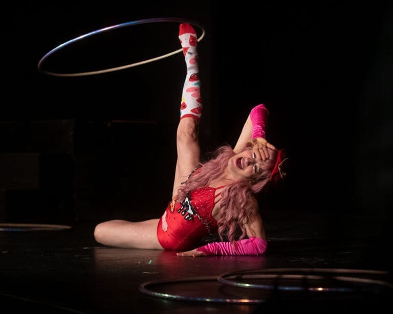 Tanya Gagné spins a hula-hoop around her foot while crying with a broken heart during the opening night of My Circus Valentine Friday