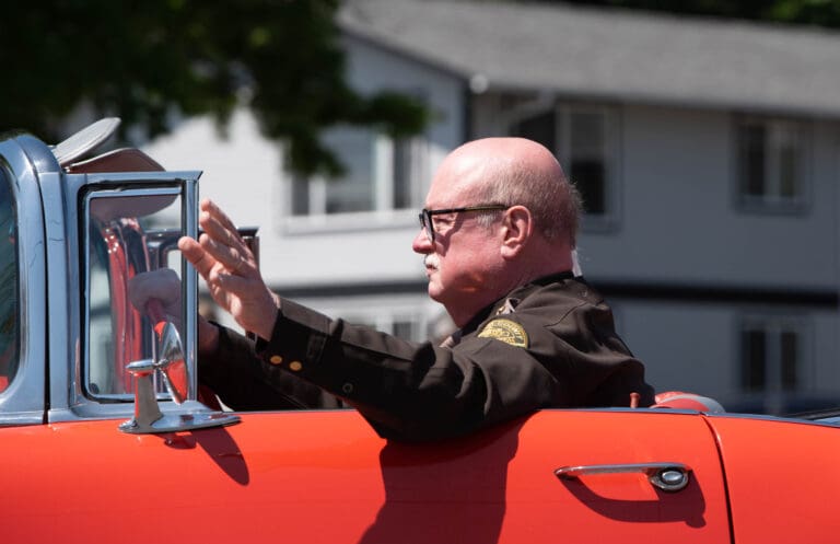 Whatcom County Sheriff Bill Elfo drives a classic Chevrolet on May 27
