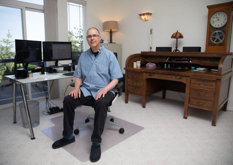 Frank Catalano sits in his Bellingham home office — the spot where he's researched and written his Cascadia Daily News business columns for the last year.