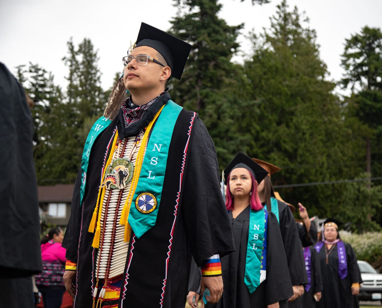Jared Gorman-Etl of the Crow Creek Sioux Tribe walks June 16 into the Northwest Indian College commencement. Gorman-Etl graduated with a Bachelor of Arts in Native Studies Leadership.