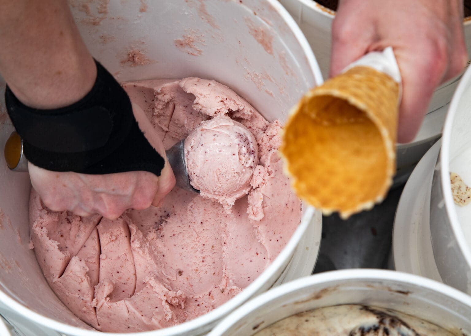 Ellen Fossett scoops strawberry cracked pink pepper ice cream at Mallard on Wednesday