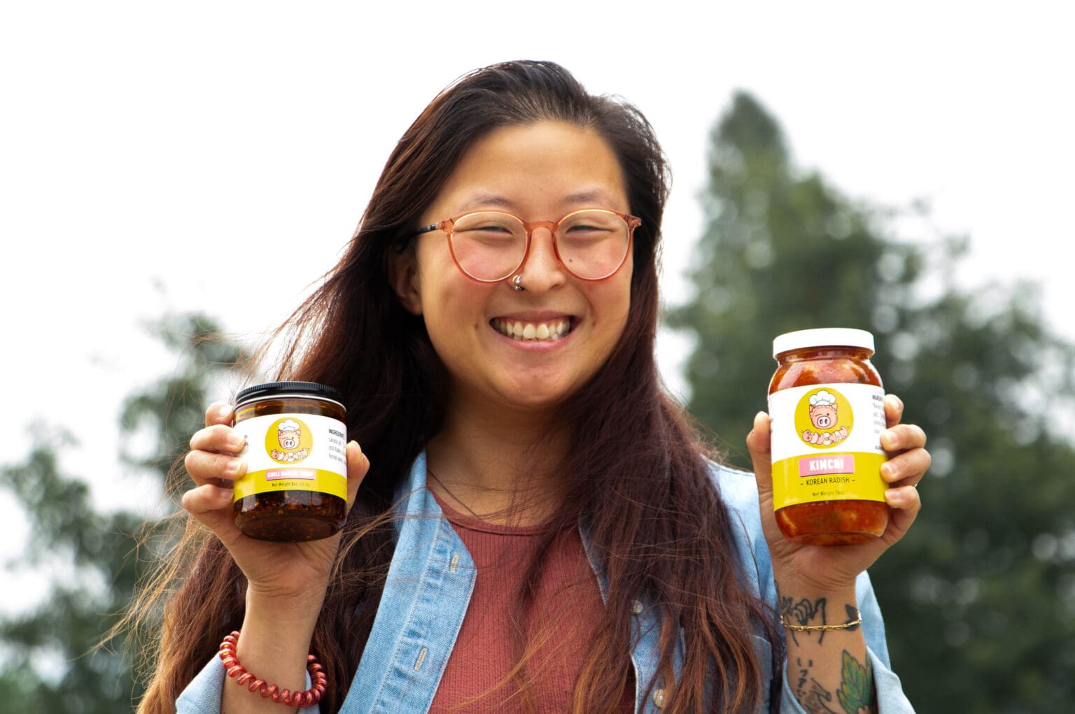 Rika Wong, the founder of Buu Chan Asian foods, shows off her homemade jars filled with kimchi products.