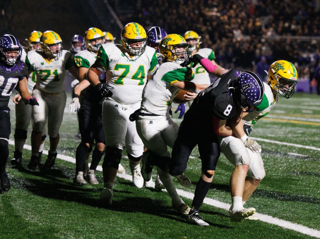 Lynden's Kaedan Hermanutz jostles between players as his teammates try to defend him from the others.