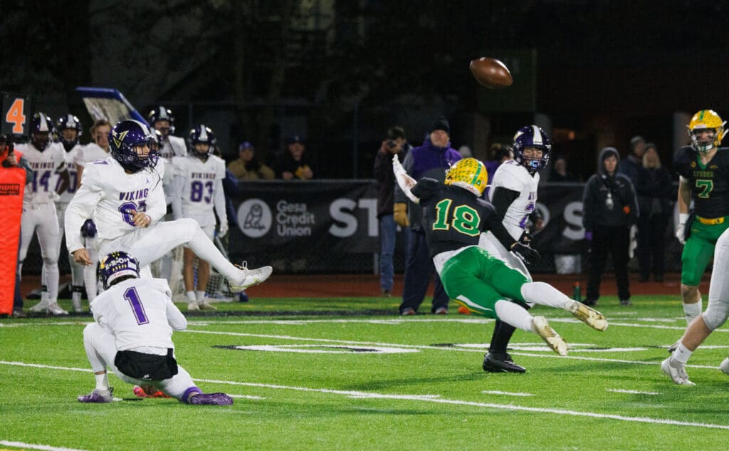 Lynden's Collin Anker blocks a kick that was returned for a Lions touchdown in the first quarter.