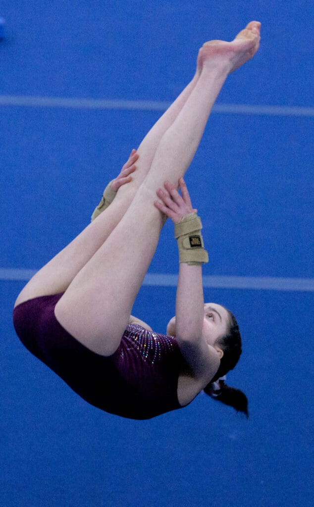 Bellingham United Gymnastics’ Elizabeth Comeau does a front pike during the floor competition at North Coast Gymnastics Academy. Comeau took third place in the event.