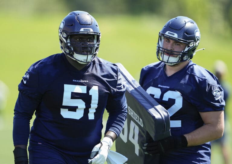 Seattle Seahawks center Olu Oluwatimi (51) and center Alex Mollette (62) regroup after a drill May 12 during the team's rookie minicamp in Renton