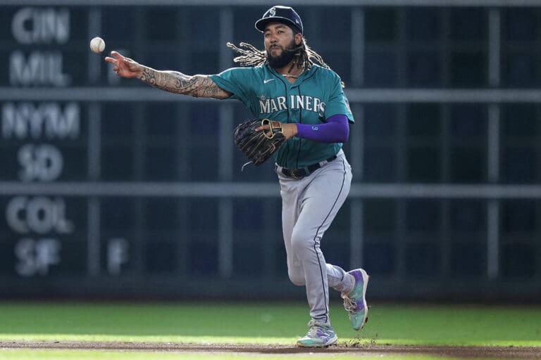 Seattle Mariners shortstop J.P. Crawford throws out Houston Astros' Mauricio Dubon at first during the first inning of a baseball game Saturday