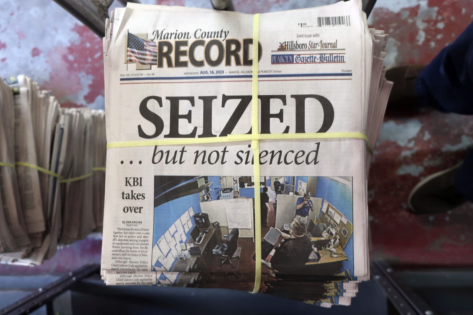 The top view of a pile of newspaper with the words 'SEIZED' as the forefront title.