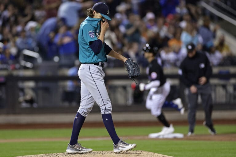 Seattle Mariners pitcher Logan Gilbert reacts after giving up a home run to New York Mets' Brandon Nimmo during the sixth inning of a baseball game Friday