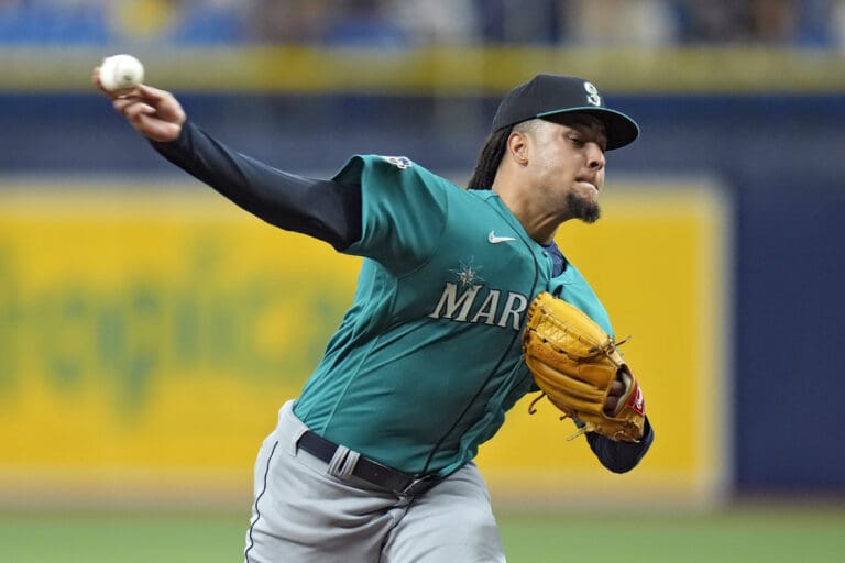 Seattle Mariners starting pitcher Luis Castillo pulls back his arm to throw a pitch.
