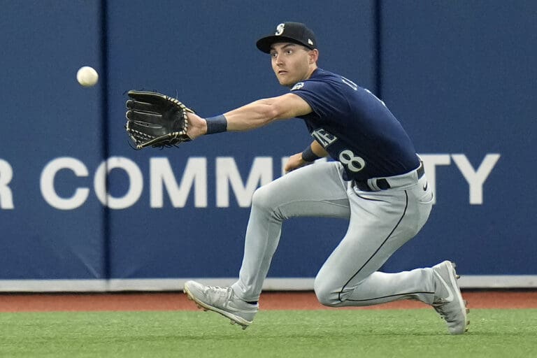 Seattle Mariners left fielder Dominic Canzone makes a catch on a fly out by Tampa Bay Rays' Josh Lowe (8) during the fifth inning of a baseball game Friday
