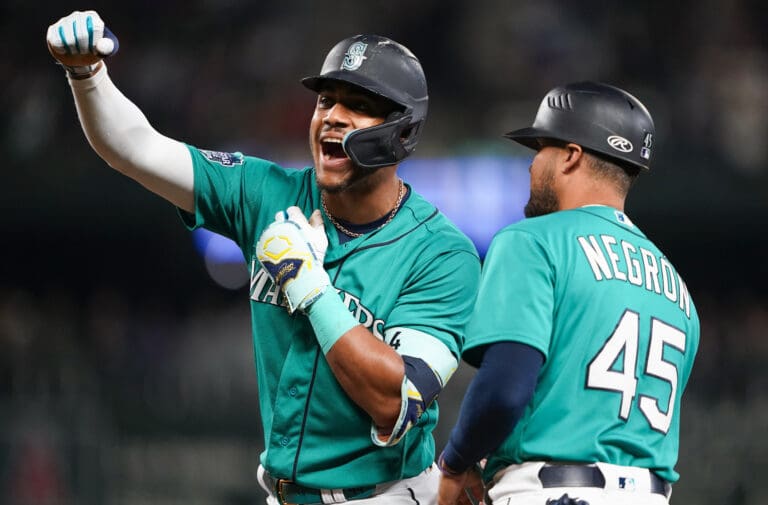 Seattle Mariners' Julio Rodriguez celebrates after hitting an RBI single against the Los Angeles Angels during the fourth inning of a baseball game