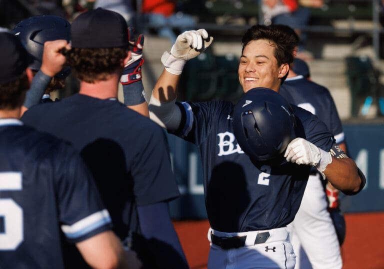 The Bellingham Bells' Cole Yoshida celebrates with teammates after his solo home run June 7 in a win over the Cowlitz Black Bears. Yoshida went 3-for-7 batting with two runs scored and four RBIs in Bellingham's two games at the Kamloops NorthPaws July 21–22 at Norbrock Stadium.