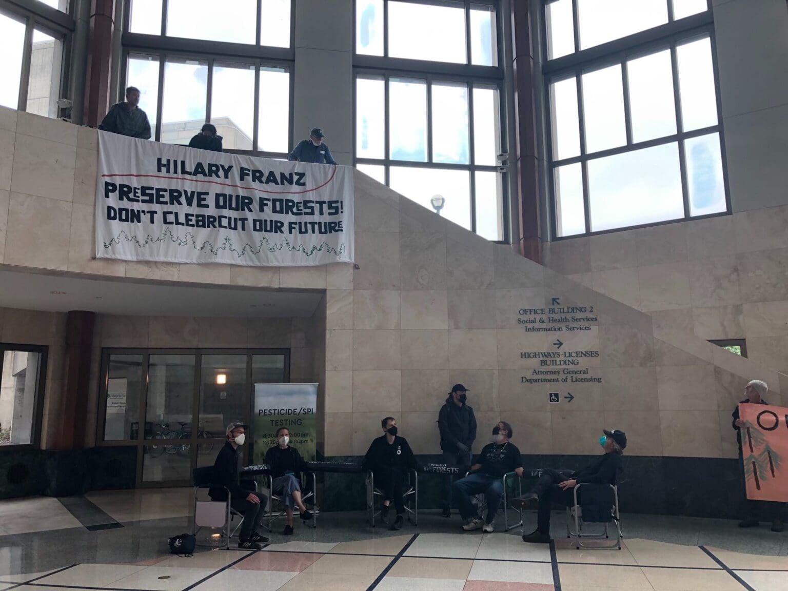 Five activists locked themselves together inside the Department of Natural Resources building in Olympia Tuesday