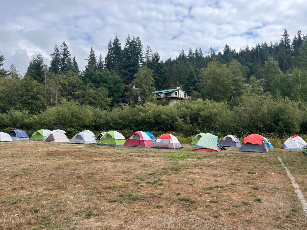 An array of colorful tents set up for camp to be used by the fire crews.