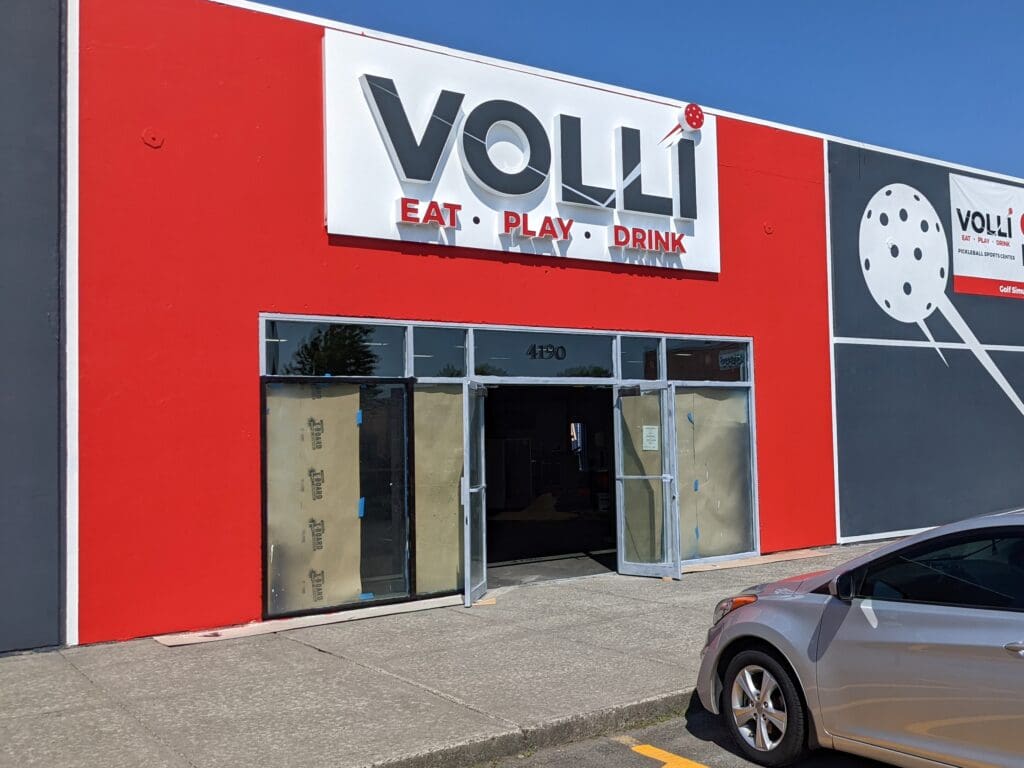 The bright red front entrance of Volli Bellingham.