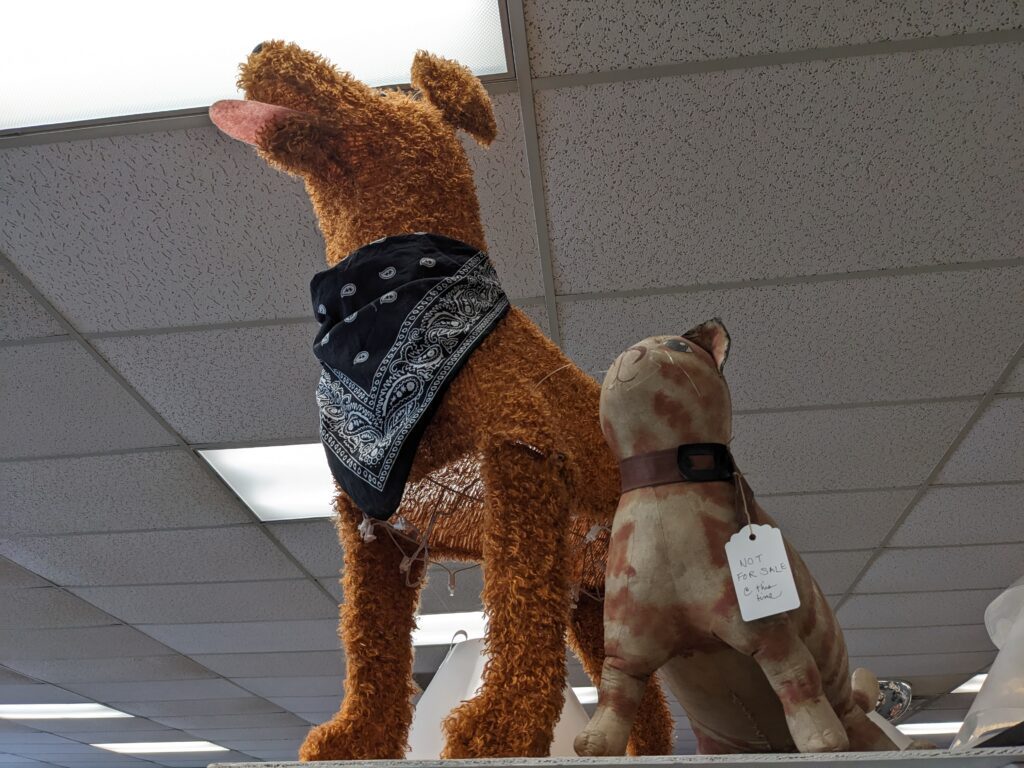 A sewn dog and cat stand with label reading "Not for sale."