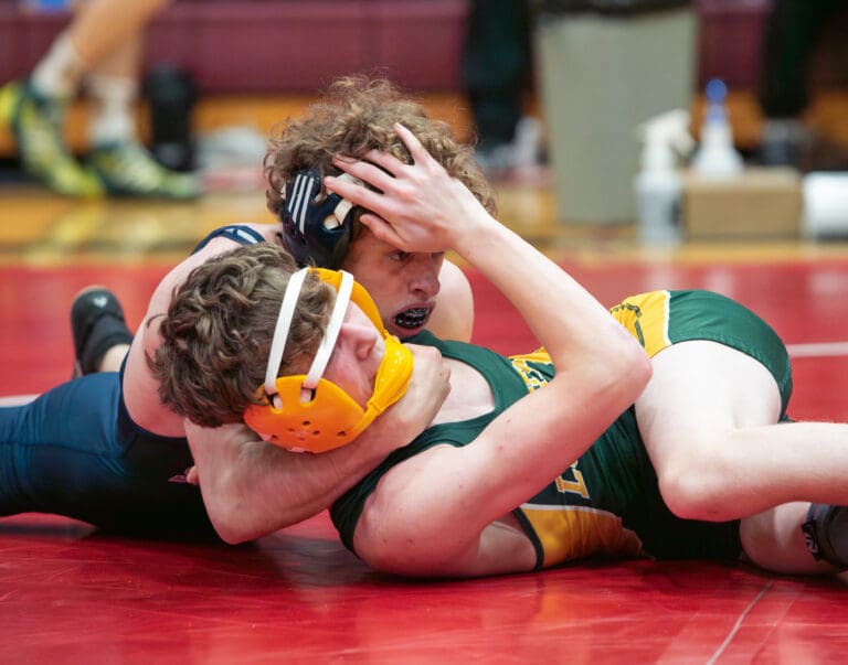 Squalicum's Jonah Papetti works to get his opponent's shoulders on the mat.