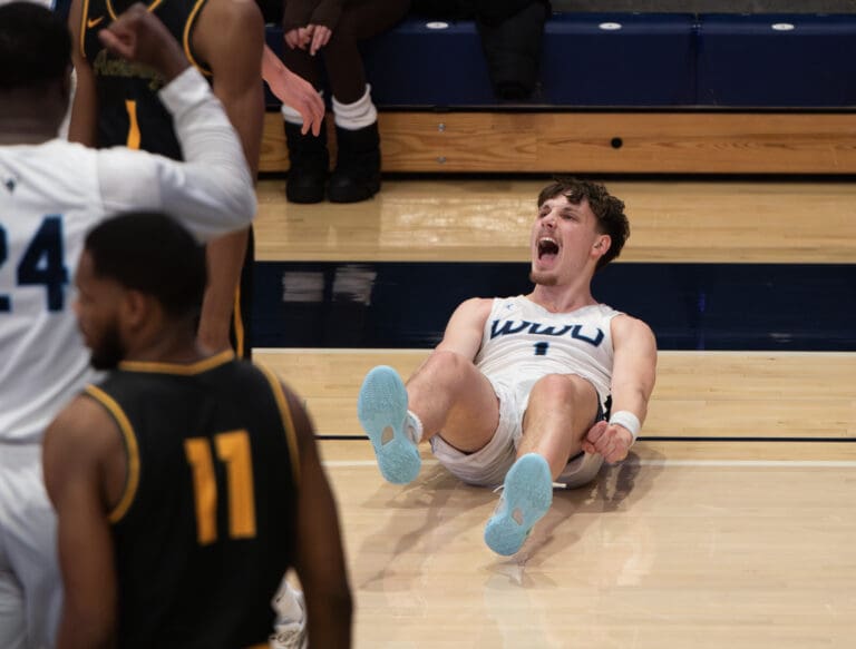 Western junior guard Kai Johnson shouts after sinking a circus shot and drawing the foul Thursday, Jan. 19 in Carver Gym. The Vikings beat the University of Alaska Anchorage 92-83 behind 29 points from Johnson.