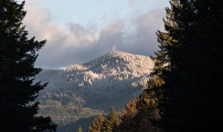 The snow-dusted Chuckanut Mountains glow in the morning light Thursday
