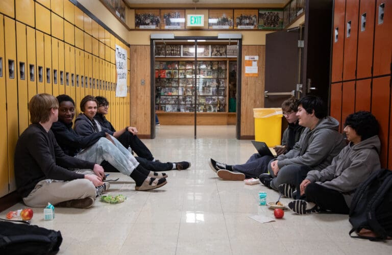 A group of students eat their lunch in the hallway outside the cafeteria on Jan. 9 at Lynden High School. The 43-year-old school building is over-capacity