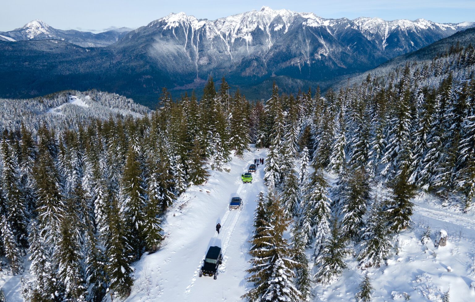 The Rainier Ridge Rams reach a stopping point while exploring a snowy logging road outside of Glacier leaving a trail of tiretrucks.