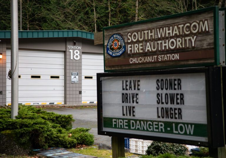 A sign showing South Whatcom Fire Authority and its logo.