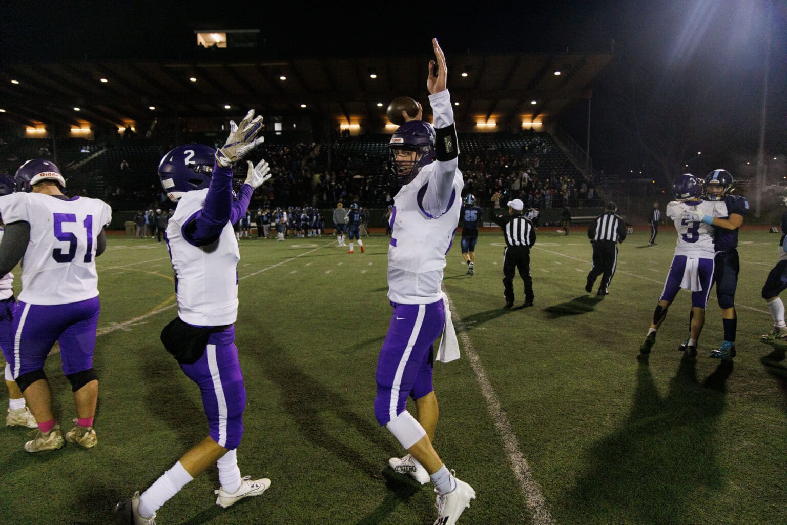 Nooksack Valley’s Joey Brown, right, and Kasey Newton celebrate with their arms stretched upwards.