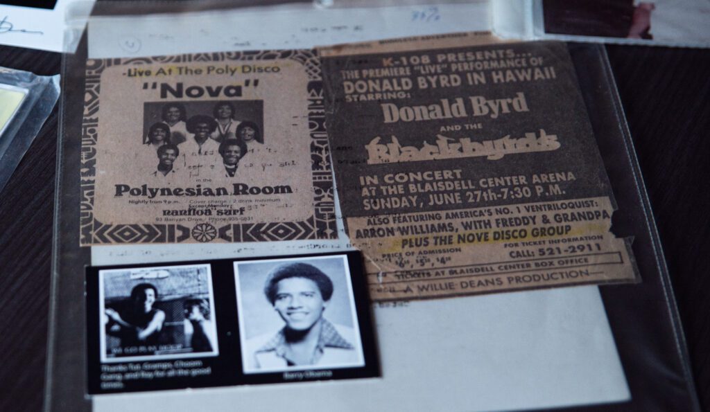 Memorbilia from Checo Tohomaso's band Nova lay on a table with photos of President Barack Obama's prom which the band played.