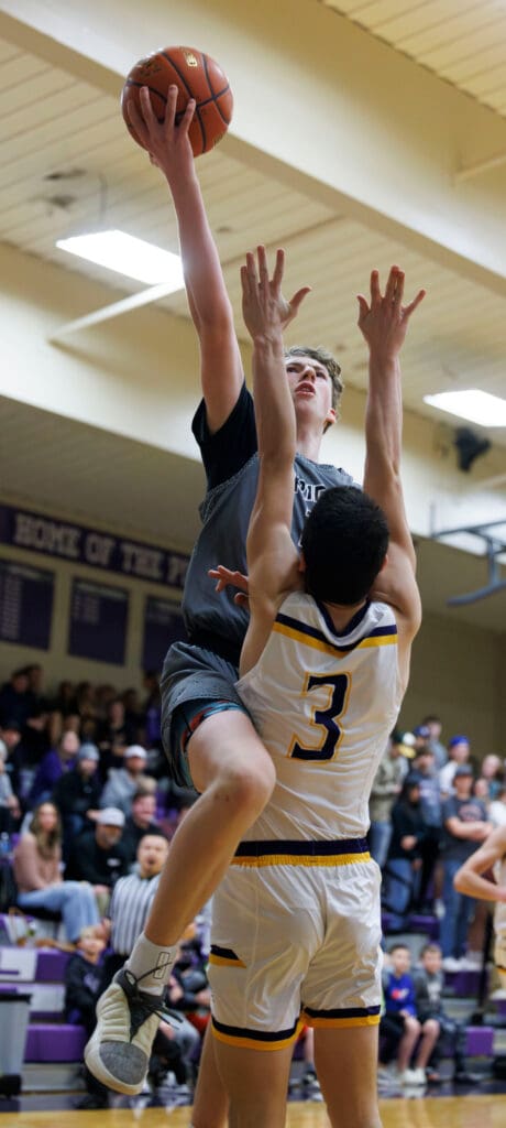 Meridian’s Talon Jenkins is called for a charging foul as Nooksack Valley's Cory Olney gets hit.