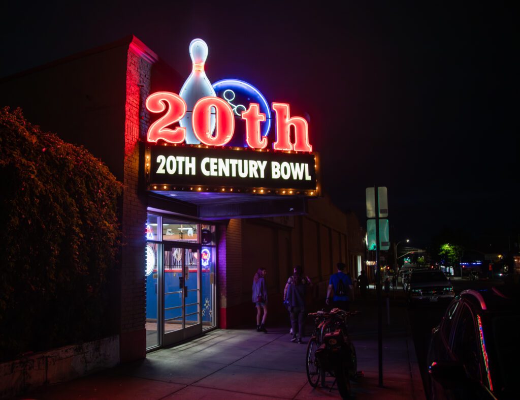 20th Century Bowl bright signage hangs above the entrance of the bowling center.