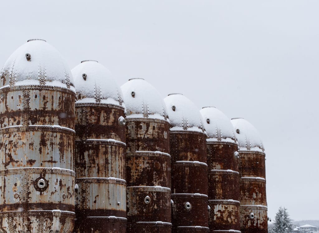 Snow clings to the tops of the digester tanks at the former site of the Georgia-Pacific pulp mill.