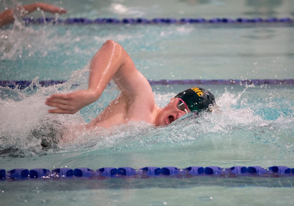 Sehome's Jake Champagne takes a breath during the 100 freestyle.