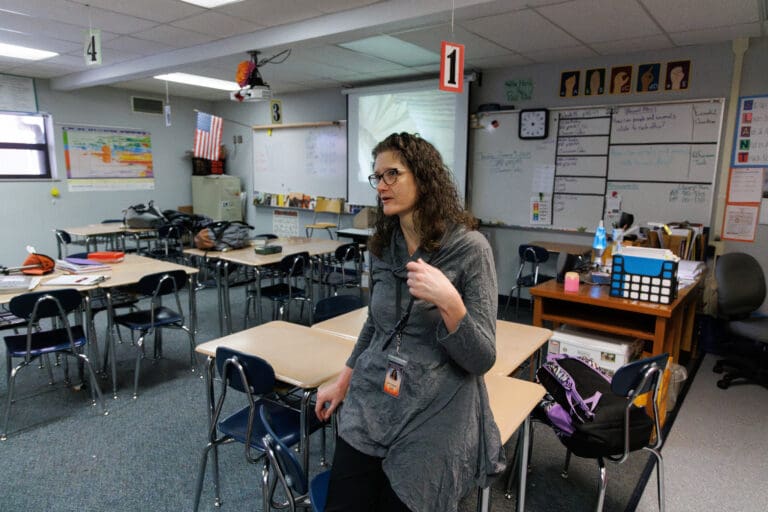 Sixth-grade teacher Julie Creager mimics fanning herself as she describes the school-year heat waves that raised room temperatures to 92 degrees at Blaine Middle School. The Blaine School District has two funding measures on the Special Election ballot this February